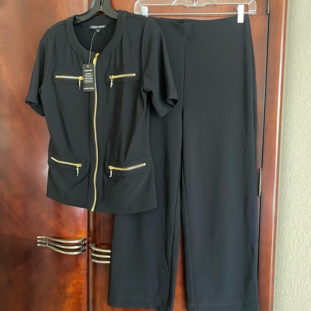 Two piece black wrinkle resistant double knit set.